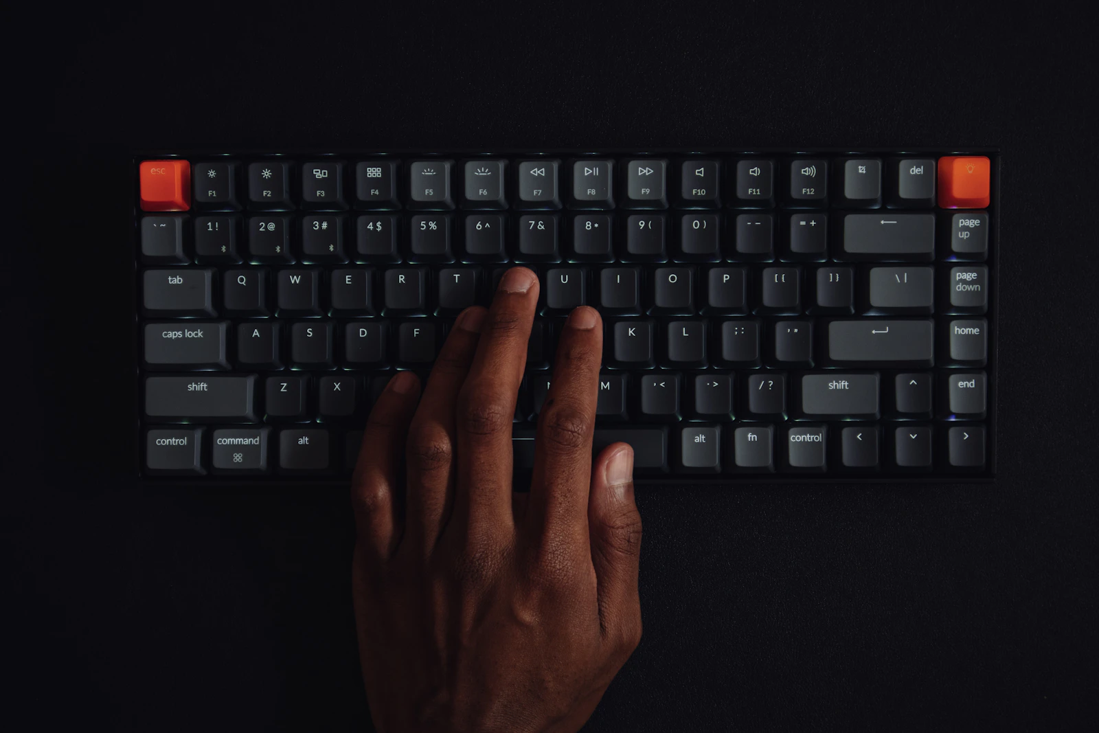 Developer working at a computer keyboard in an office